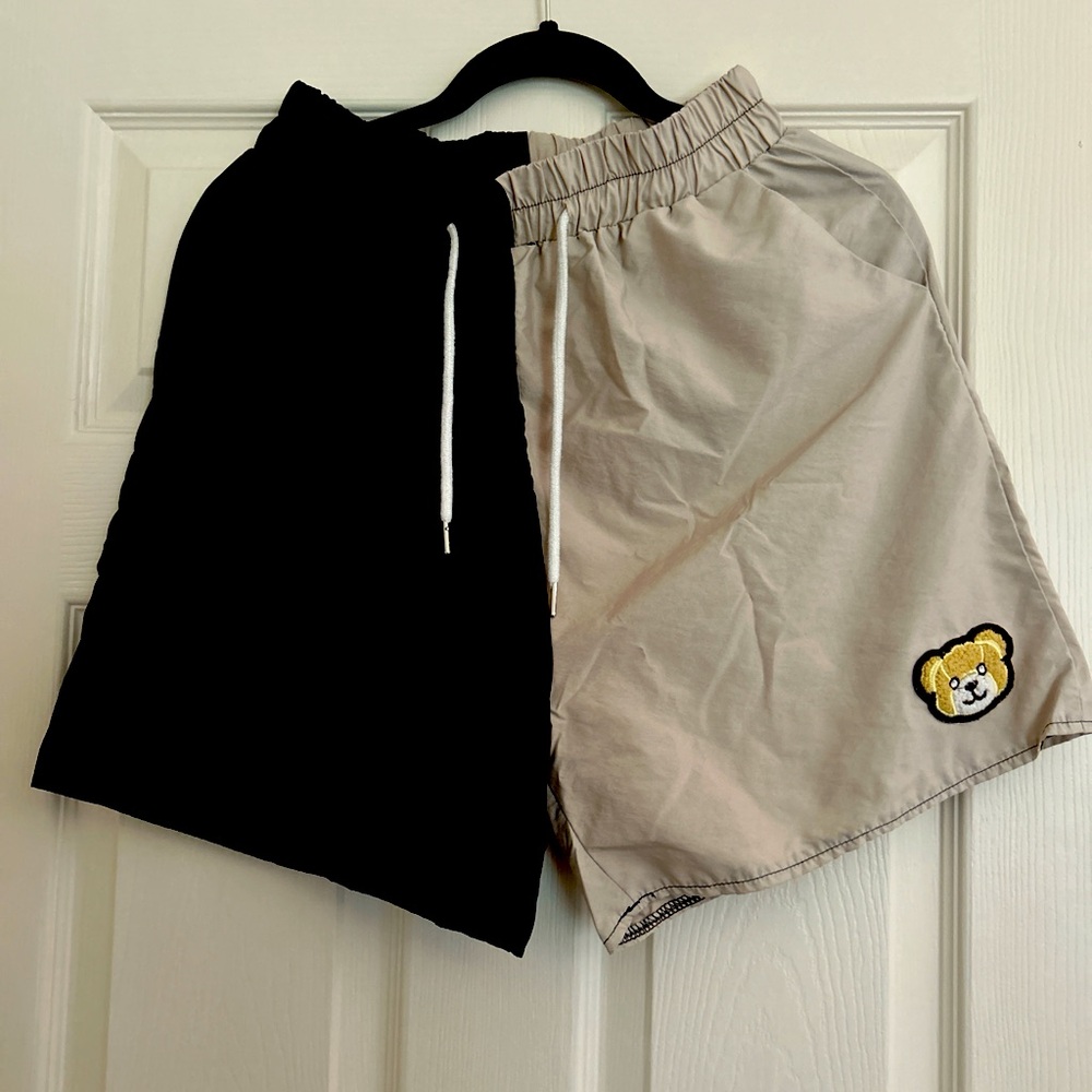 Black and beige shorts with bear logo
